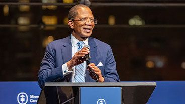 MSK’s President and CEO Dr. Selwyn Vickers speaking from a podium at the 2025 MSK Presidential Forum in New York City. 
